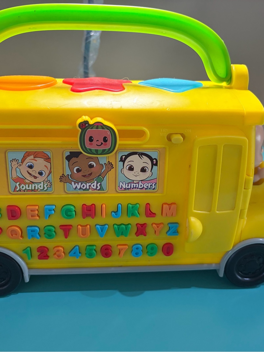 Source Unknown Yellow Learning Bus Toy with Green Handle and Multicolor Buttons
